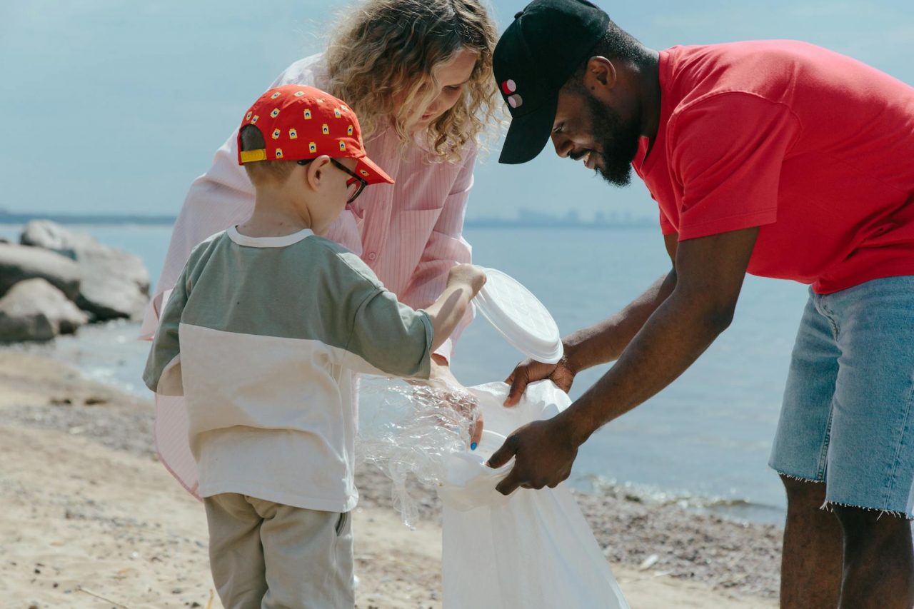 boy man and girl cleaning beach