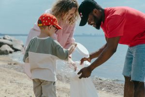 boy man and girl cleaning beach