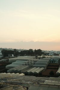 clouds over buildings roof